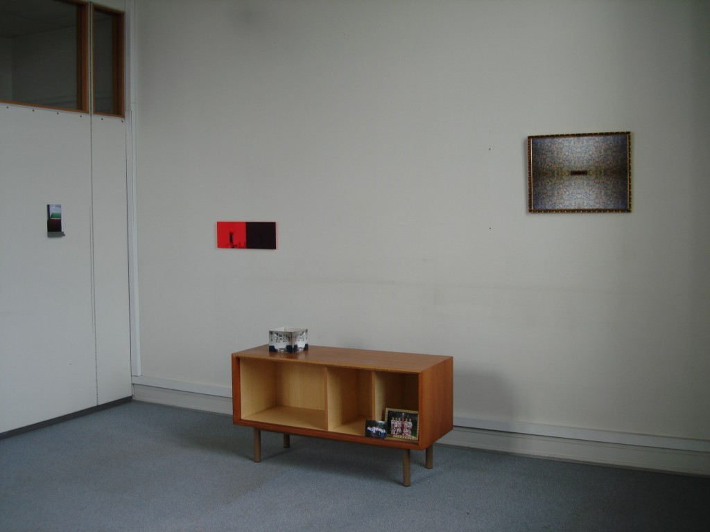 View with furniture and photgraphs from the exhibition 'Someone and Something'.
