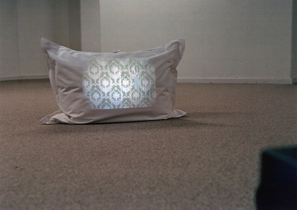 Slide projection on a pillow placed on the floor